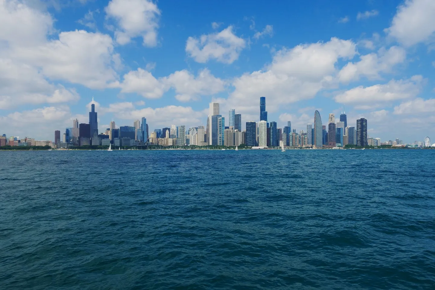 The Chicago skyline stands across the blue water of Lake Michigan in Illinois.
