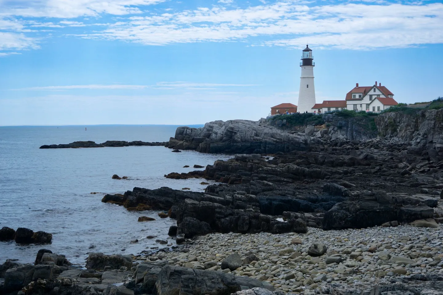 Portland Head Light stands on the rocky coast at Cape Elizabeth, Maine.