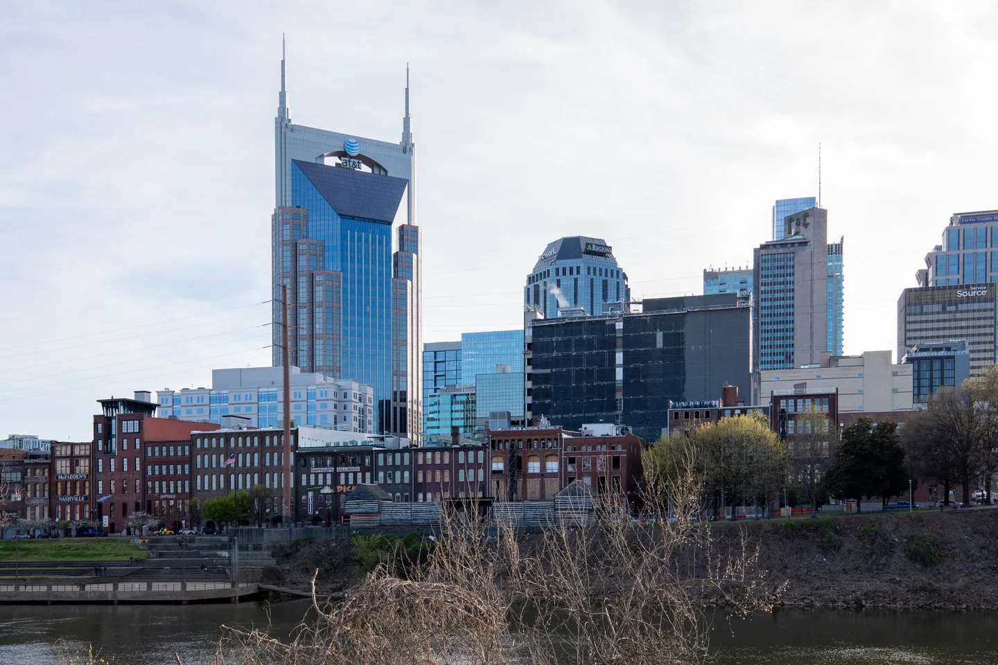 The Nashville skyline with the AT&T Building rises beside the Cumberland River in Tennessee.