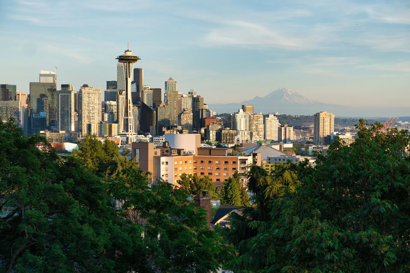 The Seattle skyline with the Space Needle and Mount Rainier in the distance in Washington.